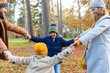 © William Perugini/Westend61 - Happy family enjoying while playing in forest