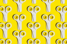 Pattern Of Rows Of School Scissors Against Yellow Background