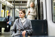© JackF - Young thoughtful woman riding in modern streetcar. Concept of daily city commuting..
