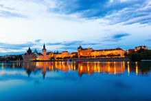 Czech Republic, Prague, City Skyline Illuminated At Dusk Seen Across River