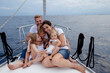 © Gala Mart√≠nez L√≥pez/Westend61 - Family sitting on deck during sailing trip