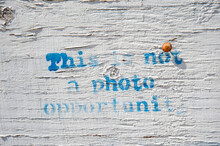 Graffiti On A Wall 'This Is Not A Photo Opportunity'