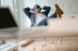 © Gustafsson/Westend61 - Businessman having a power nap at desk in office