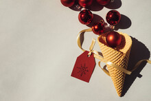 Ice Cream Cone With Red Christmas Baubles And Tag