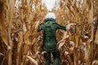 © Westend61 - Young spaceman walking through corn field