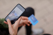 Man Taking Photo Of Credit Card Through Smart Phone
