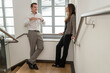 © Andreas Pacek/Westend61 - Colleagues standing in staircase talking