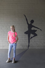 Portrait Of Laughing Blond Girl And Shadow Of Ballerina In The Background