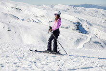 Woman Skiing On Snow-covered Landscape In Sierra Nevada, Andalusia, Spain