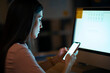 © JOSEP SURIA/Westend61 - Young woman in office using smartphone