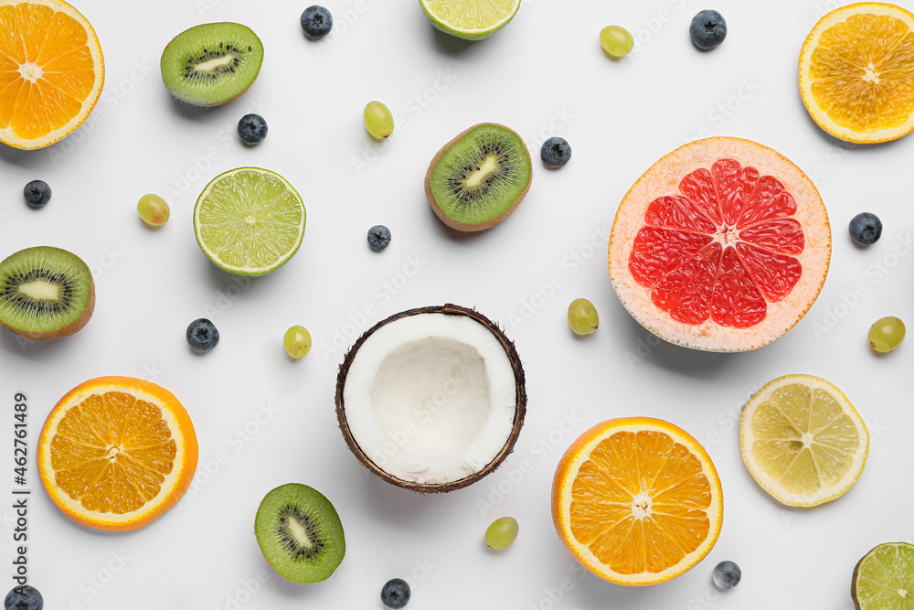 Composition with different fruits and berries on white background