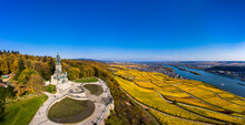 Germany, Hesse, Rudesheim Am Rhein, Helicopter View Of Clear Blue Sky Over Niederwalddenkmal Monument And Surrounding Vineyards