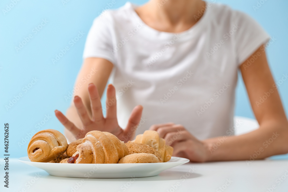 Young woman refusing from food. Anorexia concept