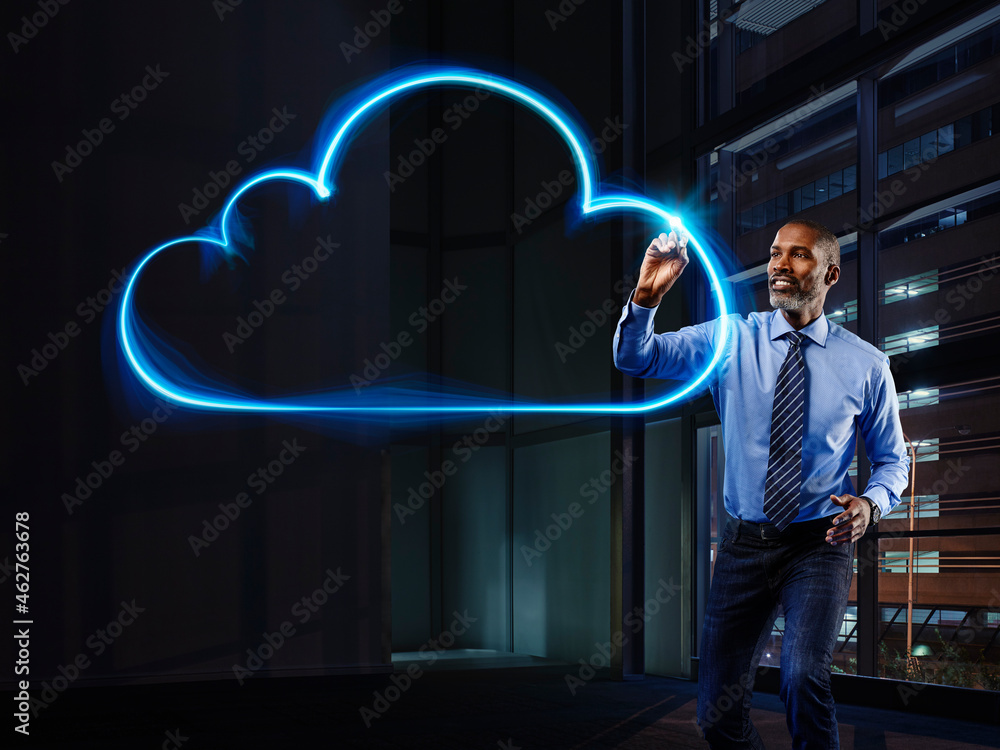 Businessman painting cloud with light Stock Photo | Adobe Stock
