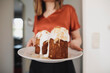 © Katharina Mikhrin/Westend61 - Woman serving garnished cake on plate