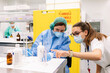 © Westend61 - Female pharmacists discussing while preparing medicines in laboratory