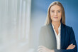 © MAGIC UNICORN/Westend61 - Facial recognition, businesswoman with grid over her face