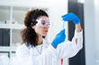 © Giorgio Fochesato/Westend61 - Young female scientist examining test tube at chemistry lab