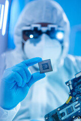 African-American scientist works in a modern scientific laboratory for the research and development of microelectronics and processors. Manufacturing worker uses computer technology and equipment.