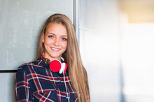 Portrait Of Smiling Young Woman With Headphones