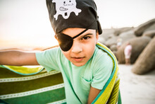Portrait Of A Boy Dressed Up As Pirat On The Beach
