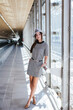 © DREAMSTOCK1982/Westend61 - Portrait of fashionable young woman at the airport