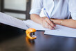 © DREAMSTOCK1982/Westend61 - Close-up of female student learning at desk at home taking notes