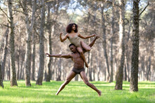 Two Professional Dancers Performing In Underwear In Middle Of Forest