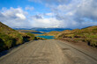 © Lorenzo Mattei/Westend61 - Chile, Ultima Esperanza Province, Clouds over empty dirt road in Torres del Paine National Park