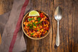 © Westend61 - Bowl of vegetarian chili with tofu, corn, kidney and pinto beans, cilantro and lime