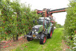 © lyzs/Westend61 - Apple harvesting on a plantation, harvester for automation
