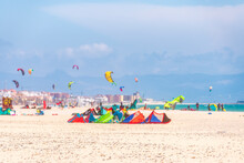 Spain, Andalucia, Tarifa, Windsurfers And Kite Surfers On The Beach