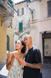 © 27exp/Westend61 - Portrait of young couple discovering the city, Lecco, Italy
