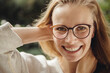© Mareen Fischinger, Photographer/Westend61 - Portrait of happy young woman with glasses