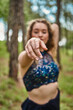 © victor espadas/Westend61 - Hand of young woman in forest pointing on viewer, close-up