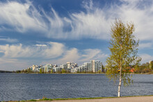 Finland, Lahti, Clouds Over Vesijarvi Lake And Modern Residential Buildings In Spring