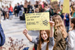 © Stefanie Baum/Westend61 - Girl holding a placard on a demonstration for environmentalism