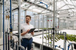 © KNSY/Westend61 - Male professional with digital tablet examining irrigation equipment in greenhouse