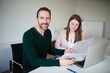 © Mike Schaefer/Westend61 - Portrait of smiling businessman and employee working at desk in office