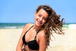 © (c) Michael Zegers/Westend61 - Portrait of happy teenage girl with braces on the beach