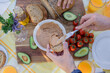 © Luna Vandoorne/Westend61 - Close-up of friends enjoying a healthy vegan breakfast outdoors