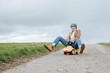 © Westend61 - Portrait of smiling mature woman riding bobby car
