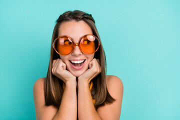 Sticker - Photo of dreamy positive young happy woman hold hands face look empty space summer isolated on teal color background