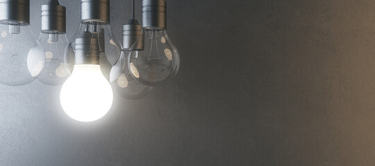 Wall Mural - Glowing light bulb on blurry wide concrete wall background. Idea, innovation, solution and invention concept. Mock up, 3D Rendering.