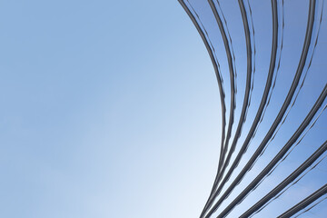 Poster - Low angle view of futuristic architecture, Skyscraper of office building with curve glass window, 3D rendering.