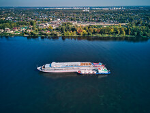 Aerial View Of Recreational Boat Being Refueled From Barge On Volga River Near City