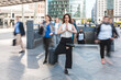 © William Perugini/Westend61 - Young businesswoman practising yoga in the city at rush hour, Berlin, Germany
