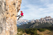 © William Perugini/Westend61 - Italy, Cortina d'Ampezzo, woman abseiling in the Dolomites mountains