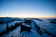 © Westend61 - Clear sky over secluded mountain hut at dusk