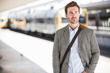 Portait Of Confident Young Businessman At The Train Station